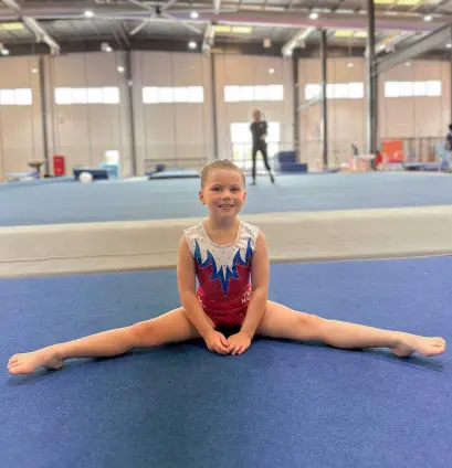 Young girl goes in for gymnastics